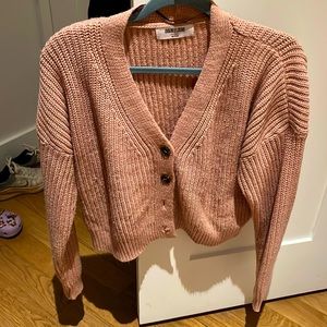 Sweater. Sits above waist